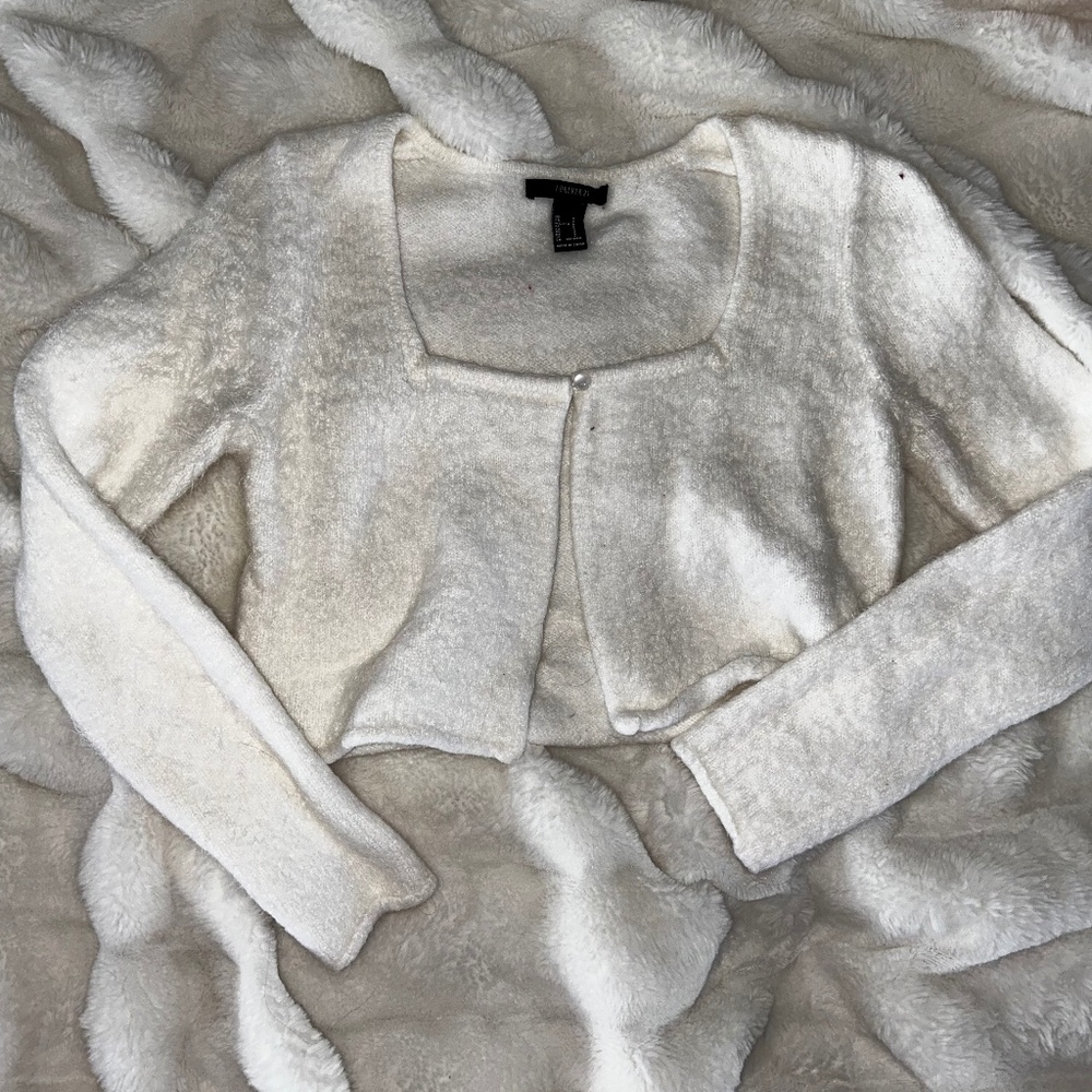 white fuzzy sweater
